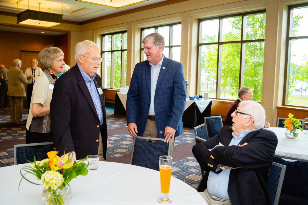 President Haas visiting with guests at the Retiree Reception.